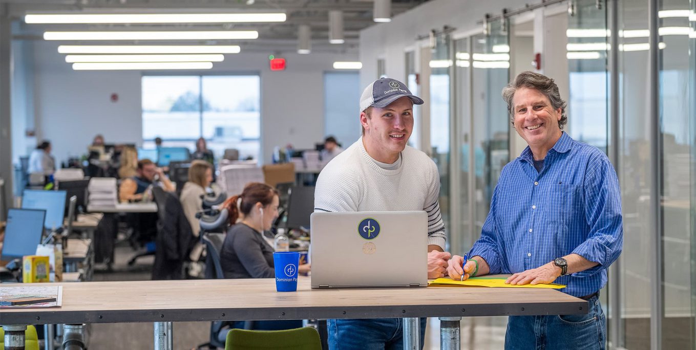 Men collaborating in office